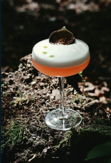 Signature cocktail in coupe glass