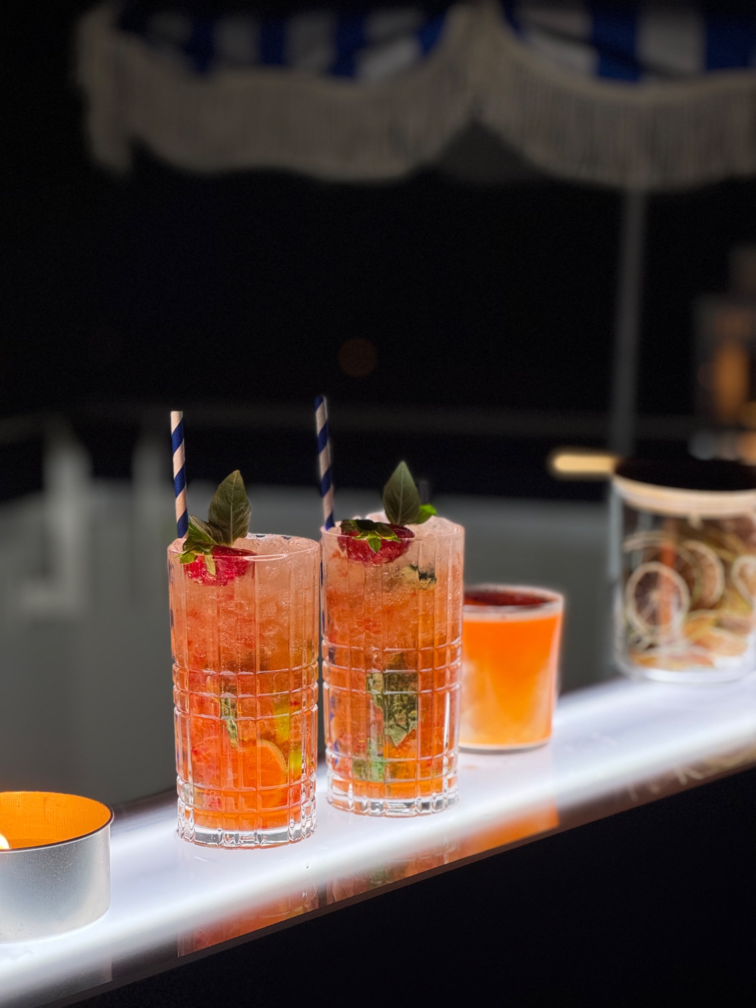 Two orange signature cocktails during evening service